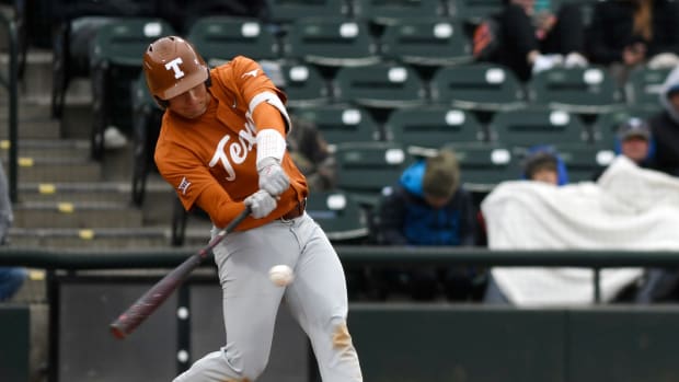Texas' Ivan Melendez hits the ball against Texas A&M-Corpus Christi, Wednesday, Feb. 23, 2022, at Whataburger Field. Texas won, 5-4